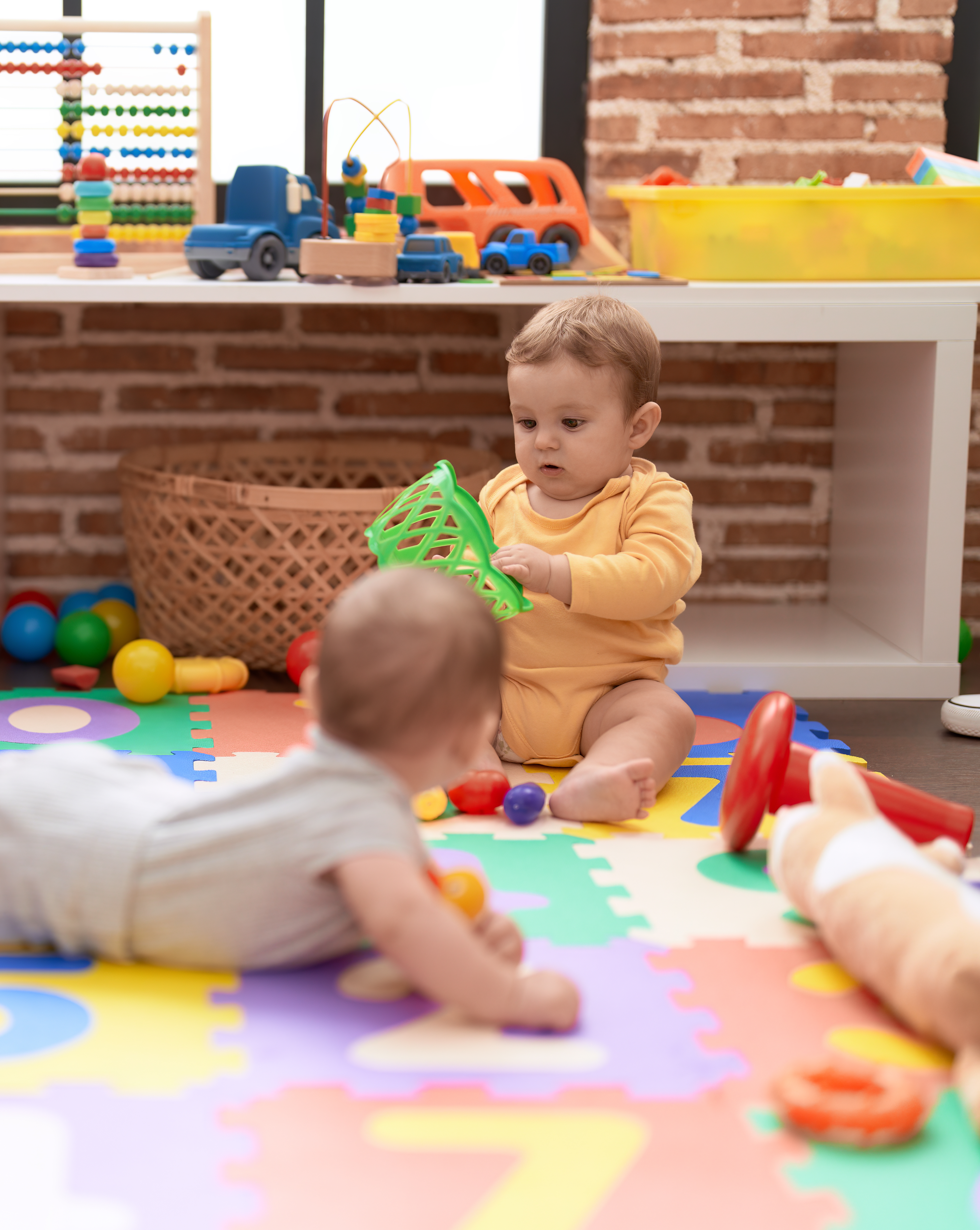 Early development through  sensory exploration, fostering independence and trust from the very beginning.